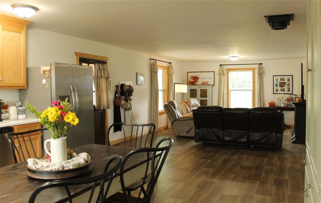 765 Addison Road Buchanan, GA 30113 - Photo 15 of 34 a living room with furniture potted plant kitchen view and a window