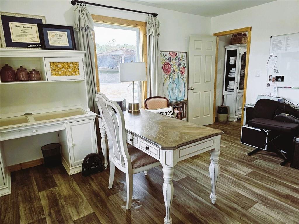 765 Addison Road Buchanan, GA 30113 - Photo 17 of 34 a view of a dining room with furniture and wooden floor