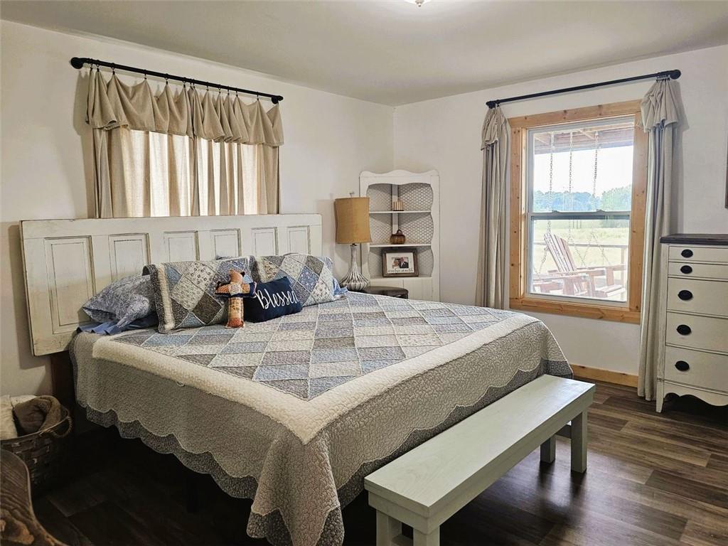 765 Addison Road Buchanan, GA 30113 - Photo 18 of 34 a bed sitting in a bedroom next to a window