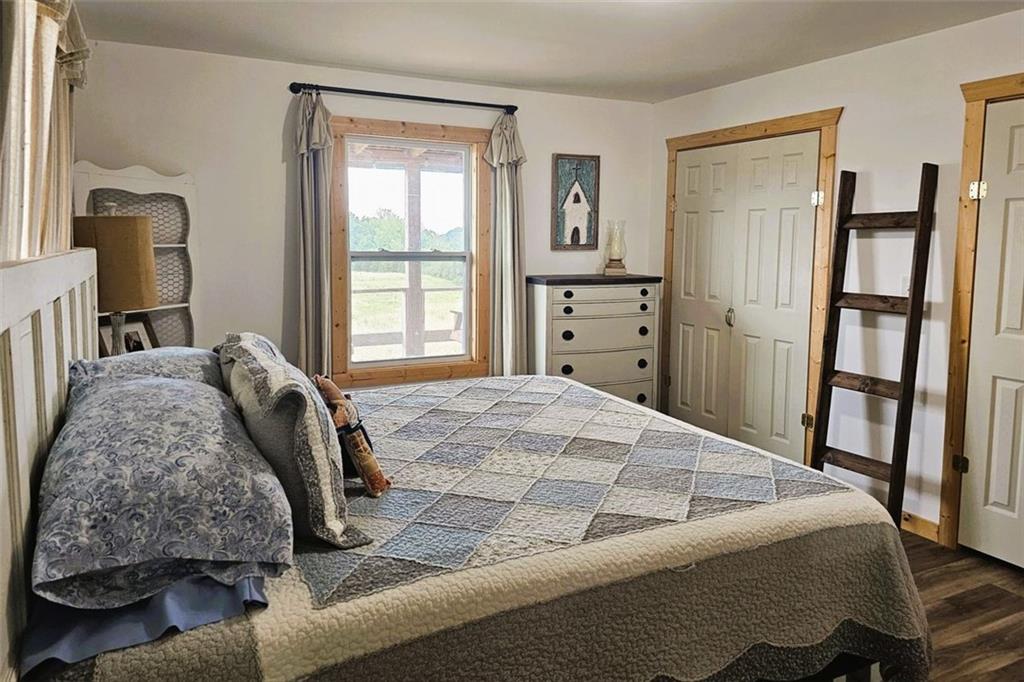 765 Addison Road Buchanan, GA 30113 - Photo 19 of 34 a bed sitting in a bedroom next to a window