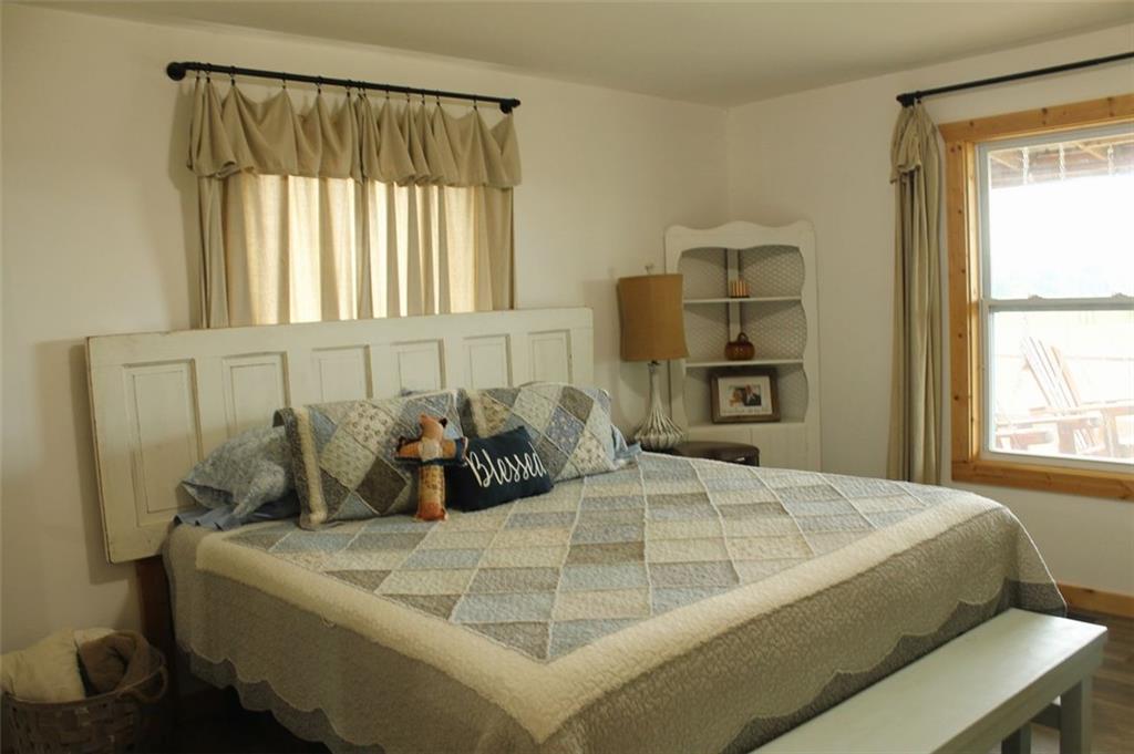 765 Addison Road Buchanan, GA 30113 - Photo 20 of 34 a bedroom with a bed and window