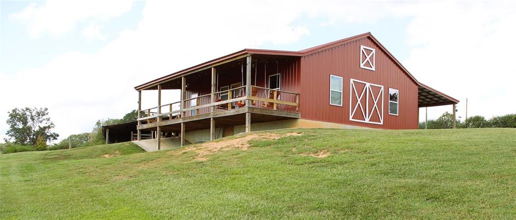 765 Addison Road Buchanan, GA 30113 - Photo 2 of 34 a view of a house with a backyard