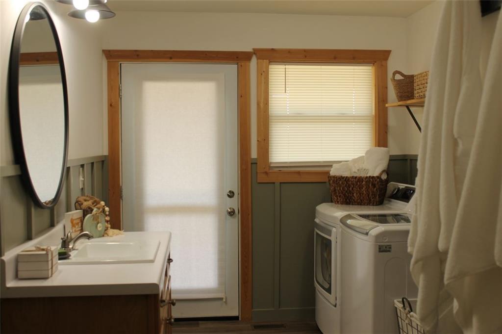 765 Addison Road Buchanan, GA 30113 - Photo 22 of 34 a bathroom with a sink a toilet and a mirror