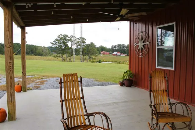 a view of a patio with a yard