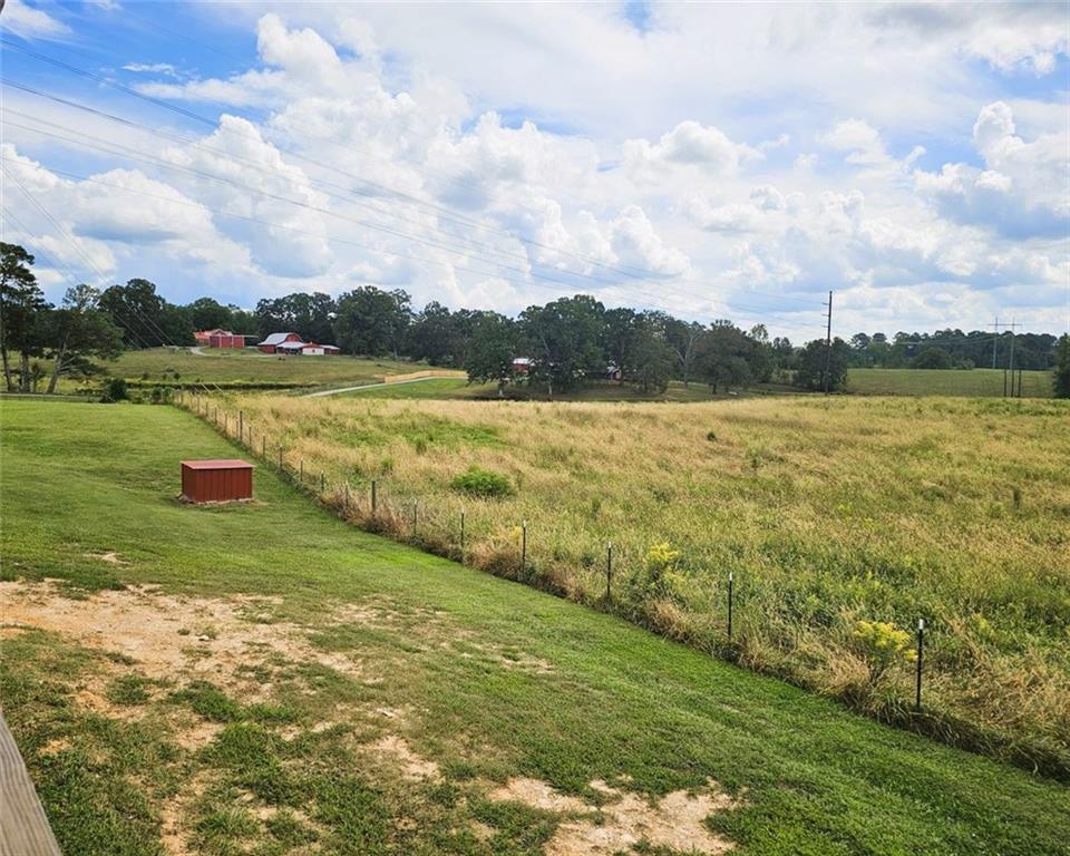 765 Addison Road Buchanan, GA 30113 - Photo 32 of 34 a view of a lake with a big yard