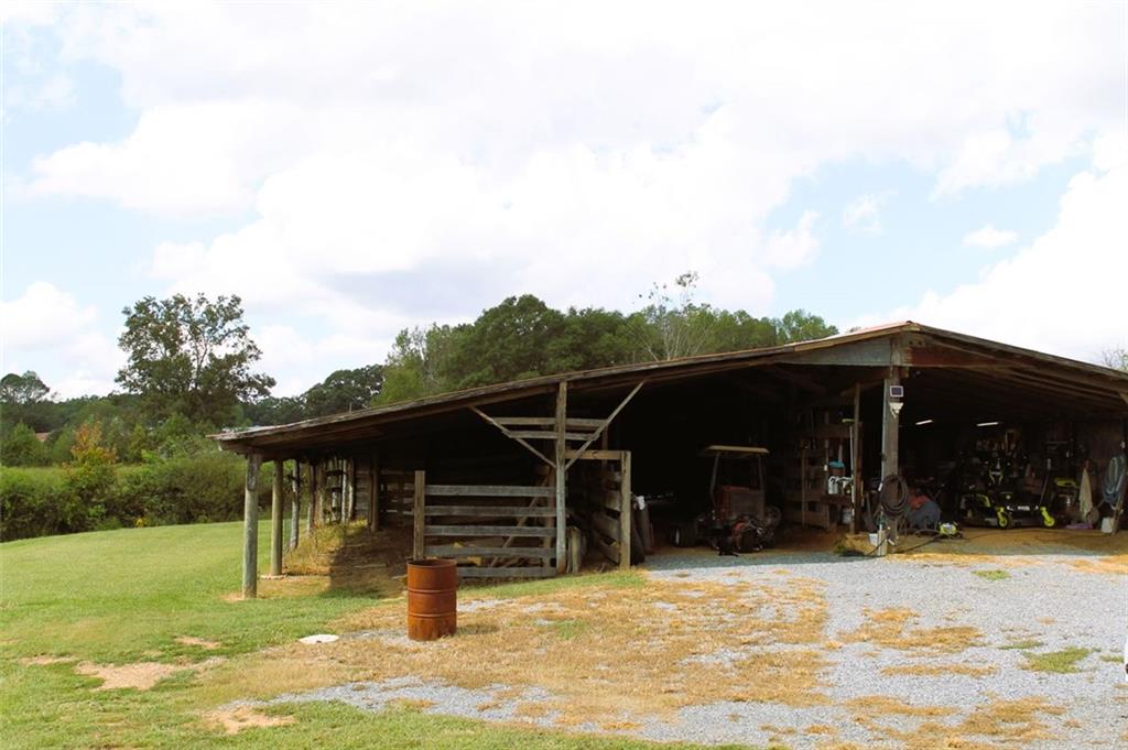 765 Addison Road Buchanan, GA 30113 - Photo 34 of 34 a view of a house with backyard porch and sitting area
