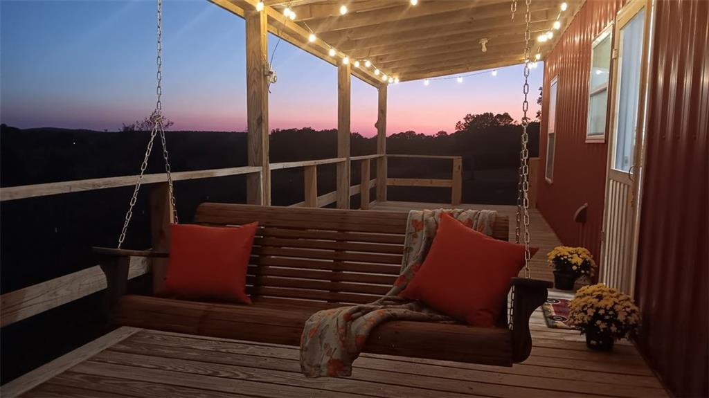 765 Addison Road Buchanan, GA 30113 - Photo 9 of 34 a roof deck with wooden floor and city view