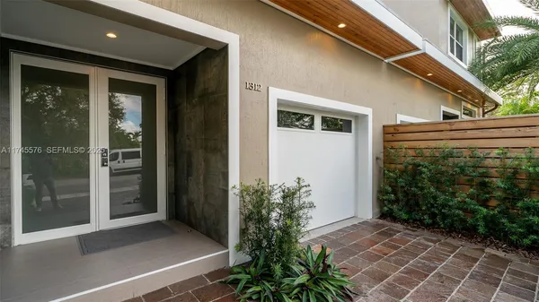 a kitchen with a sink and a stove