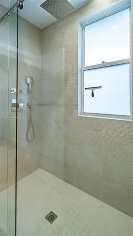 a bedroom with a bed and hallway