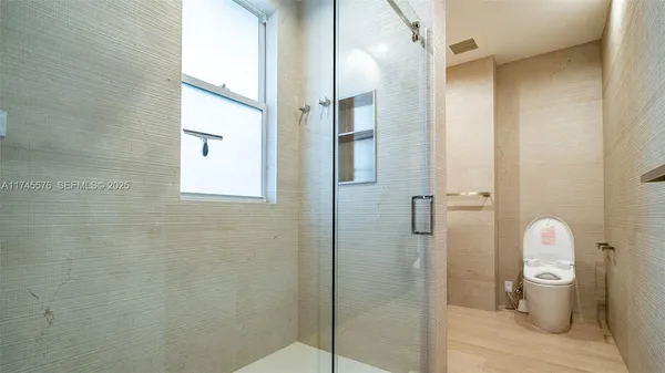 a bedroom with a bed and a table