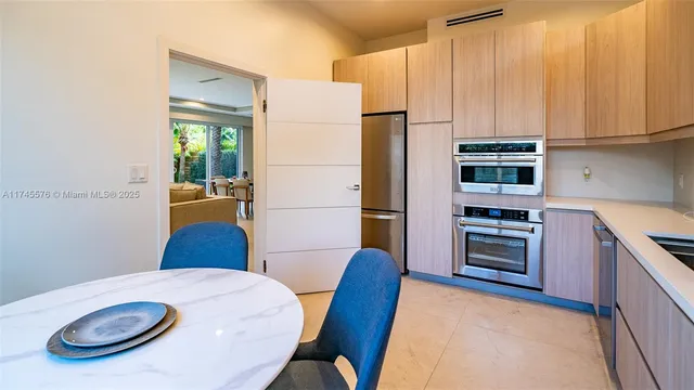 a view of a dining room with furniture and window