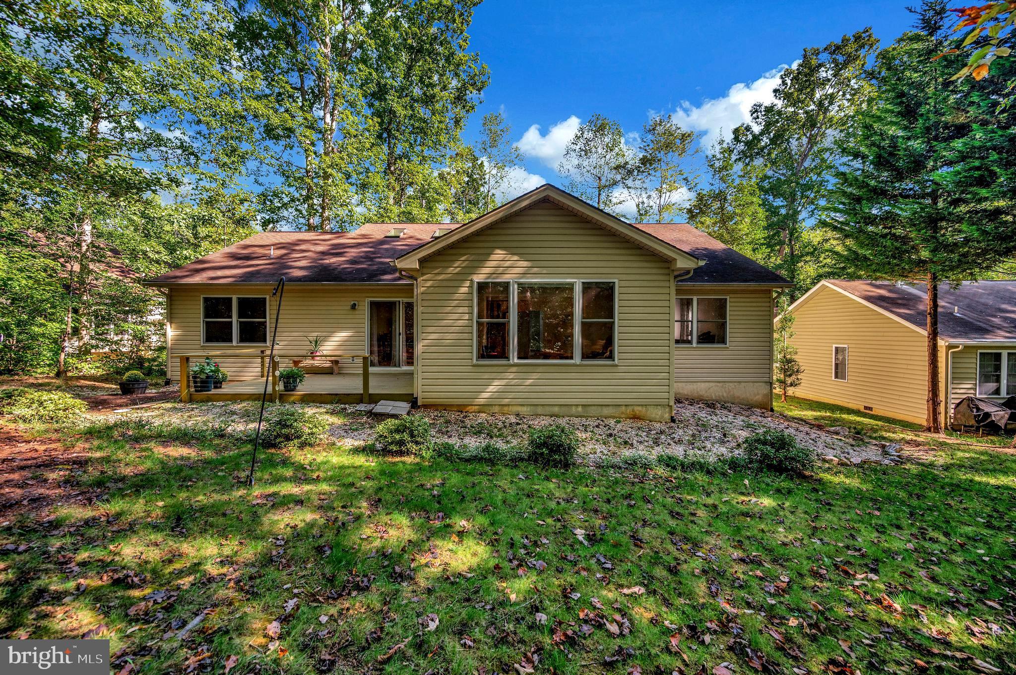216 Battlefield Road Locust Grove, VA 22508 - Photo 43 of 61 Backyard view towards Family room picture window