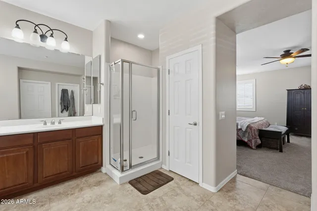 a living room with furniture and a ceiling fan