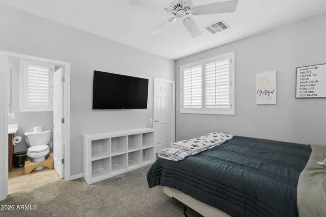 a view of a storage & utility room with refrigerator and racks