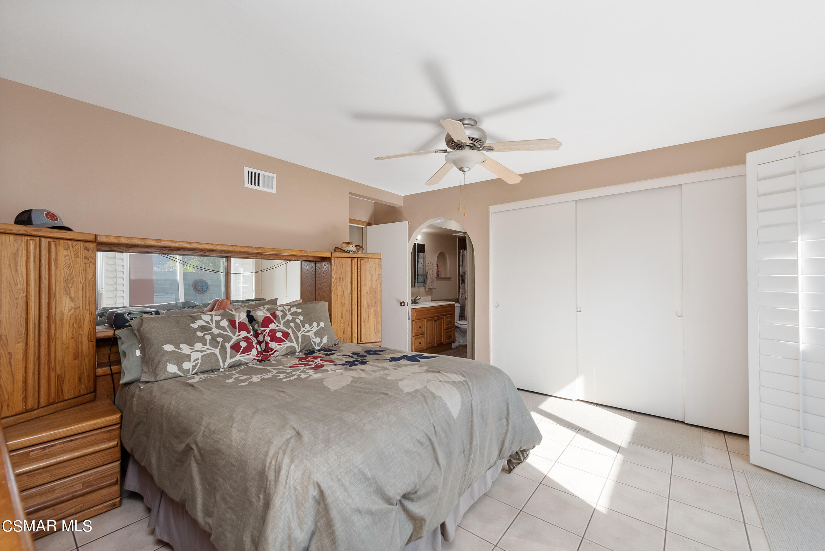 6448 Keystone Street Simi Valley, CA 93063 - Photo 22 of 30 a large bedroom with bed and wooden floor