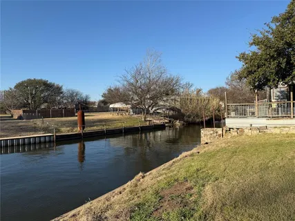 a view of a park with large trees