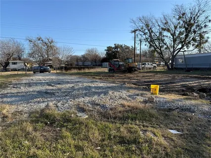 a view of swimming pool with outdoor seating and covered with trees