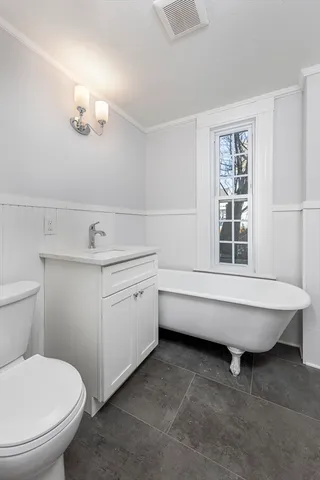 a bathroom with a sink a toilet and bathtub