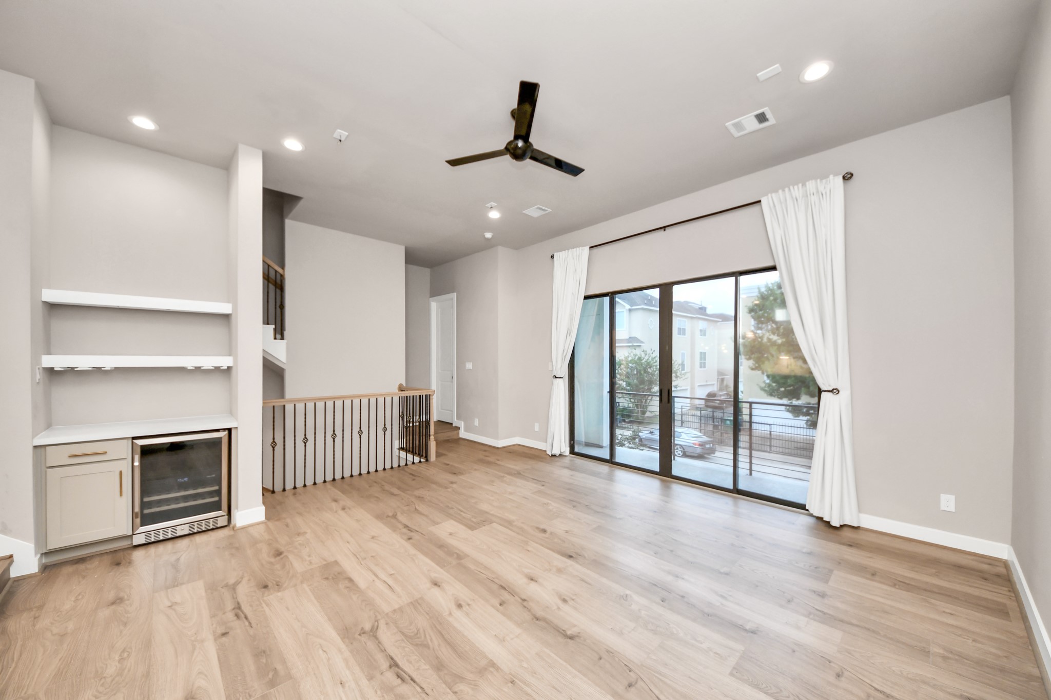 2114 Stuart Street Houston, TX 77004 - Photo 21 of 39 a view of an empty room with a fireplace and a window