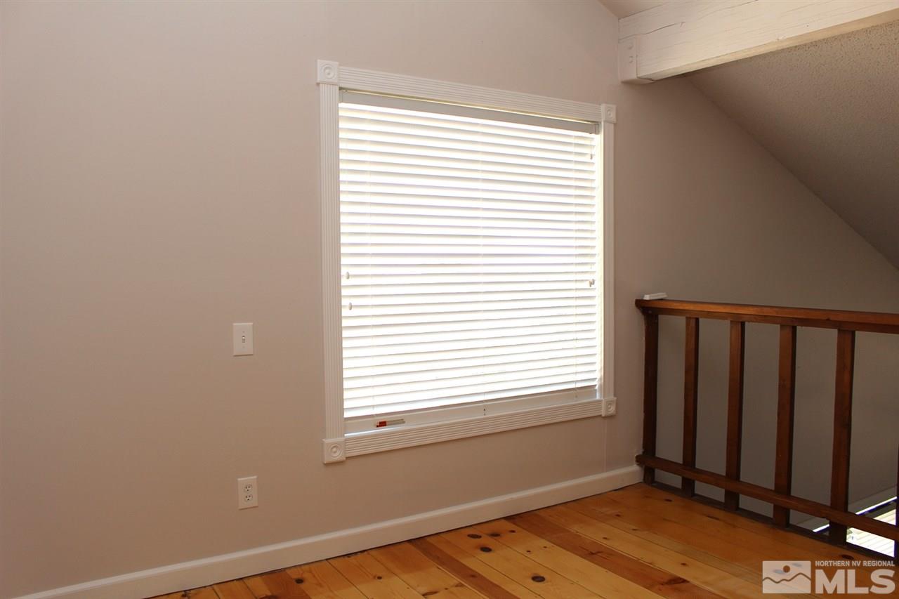 15380 Yankee Blade Road Reno, NV 89521 - Photo 24 of 40 a view of a room with wooden floor and a window