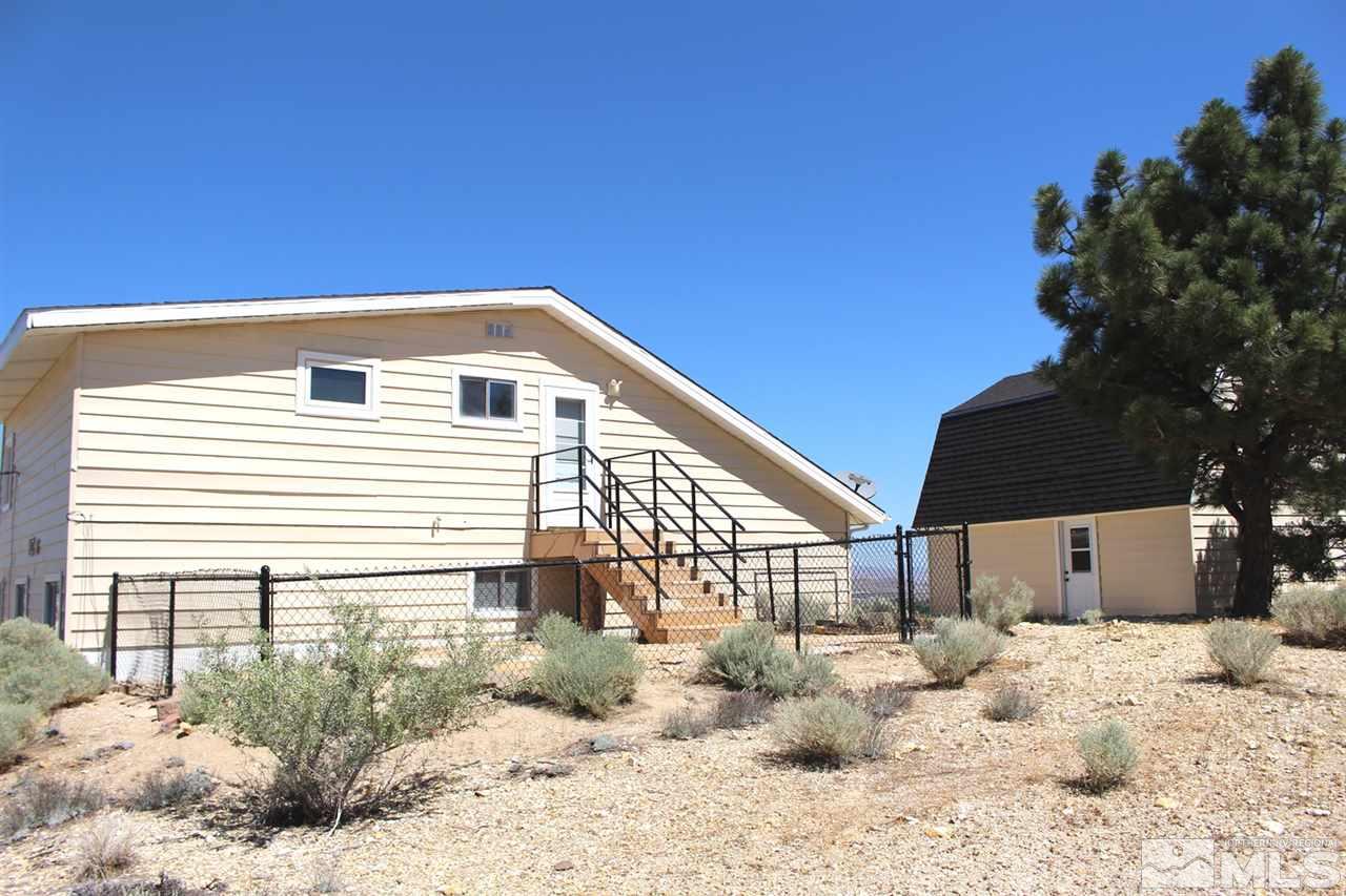 15380 Yankee Blade Road Reno, NV 89521 - Photo 32 of 40 a front view of a house with a yard
