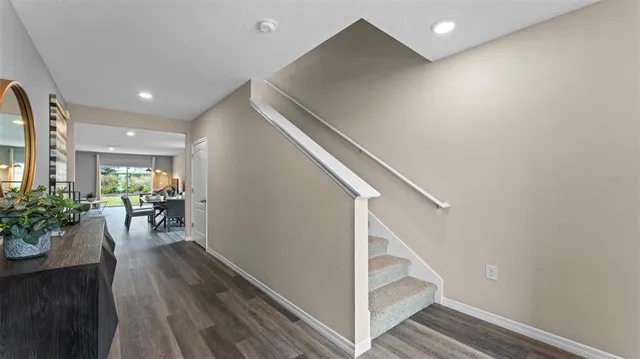 a view of entryway with livingroom and wooden floor
