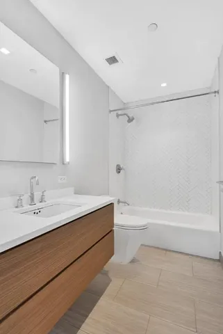 a bathroom with a bathtub and a sink