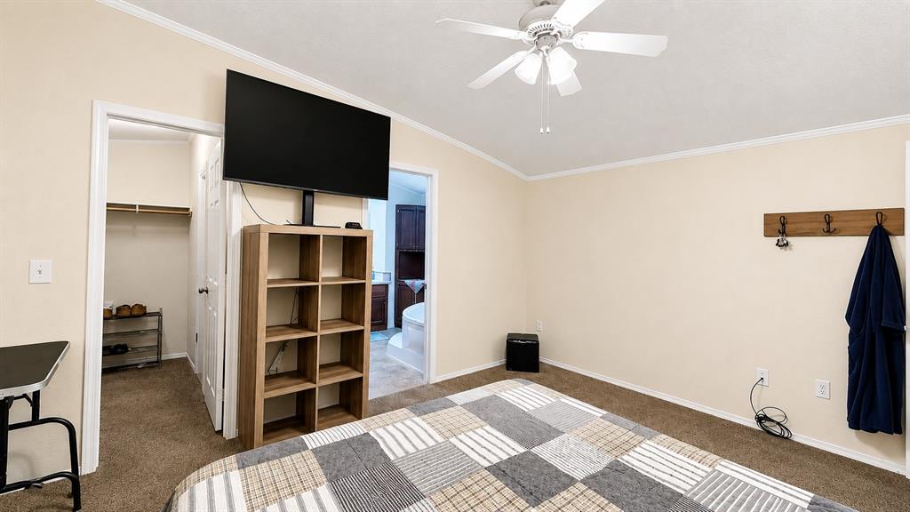 741 Waterfront Row Quitman, TX 75783 - Photo 18 of 40 a view of a livingroom with furniture and a flat screen tv