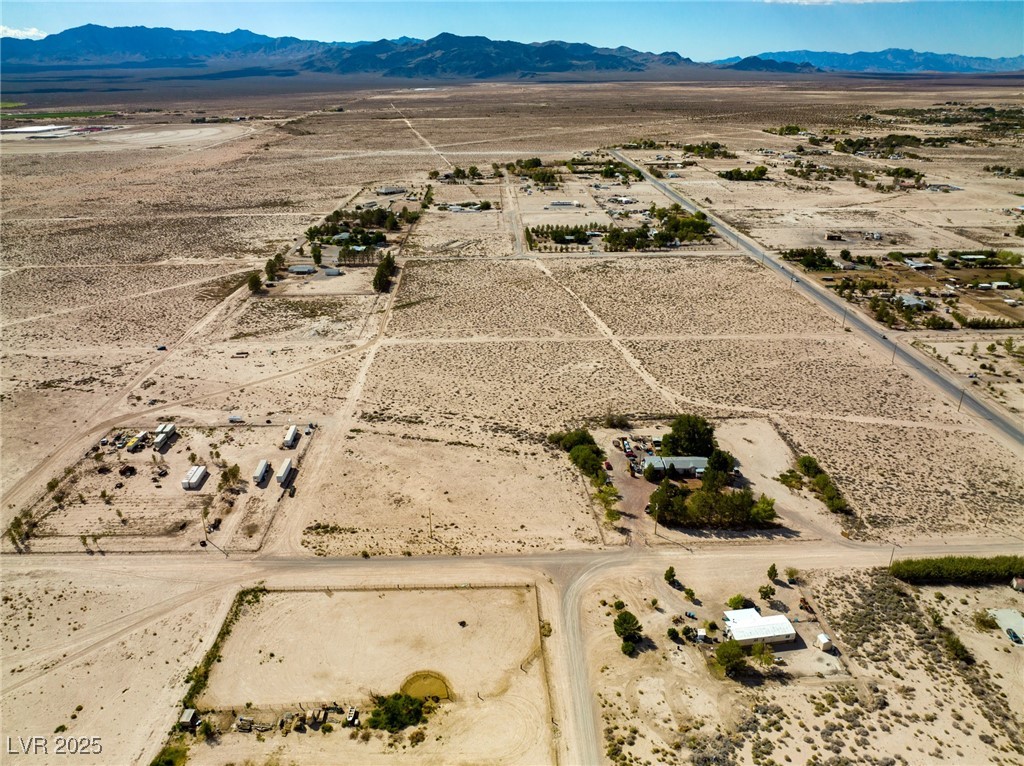 Marble Sandy Valley, NV 89019 - Photo 10 of 31 Birds eye view of property with a mountain view, a desert view, and a rural view