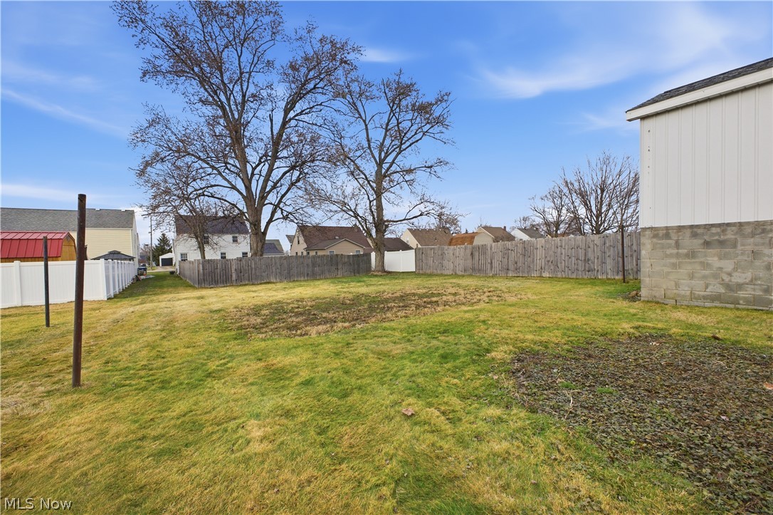 227 Wilson Street Struthers, OH 44471 - Photo 2 of 44 Fenced backyard featuring a residential view