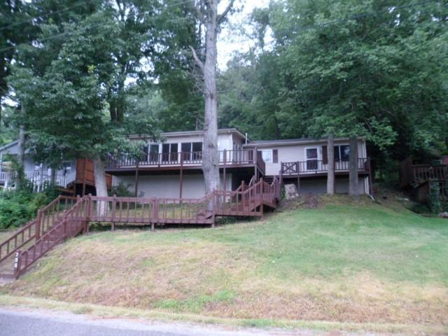 796 Lake Logan Road Ardmore, TN 38449 - Photo 2 of 14 front view of a house with a deck and a yard
