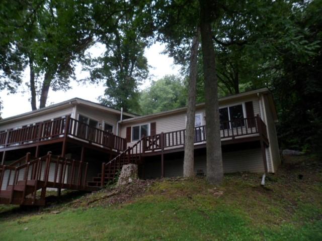 796 Lake Logan Road Ardmore, TN 38449 - Photo 11 of 14 a view of a house with backyard and sitting area