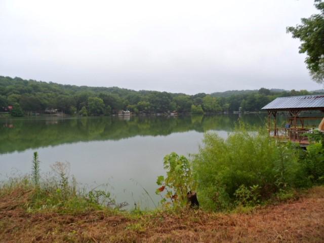 796 Lake Logan Road Ardmore, TN 38449 - Photo 14 of 14 a view of a lake with a mountain in the background