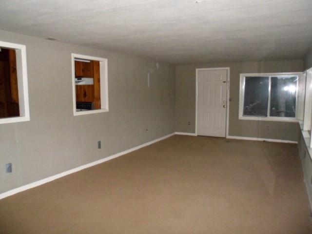 796 Lake Logan Road Ardmore, TN 38449 - Photo 5 of 14 an empty room with a empty space and window