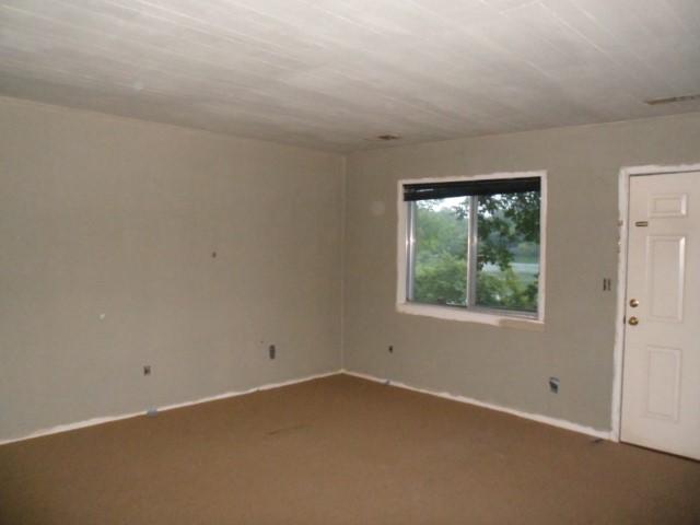 796 Lake Logan Road Ardmore, TN 38449 - Photo 8 of 14 an empty room with a window