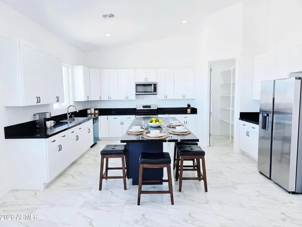 a view of a room that has a bed and a window in it