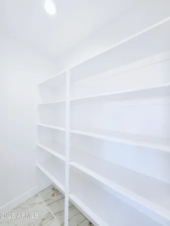 a bathroom with a double vanity sink mirror and shower