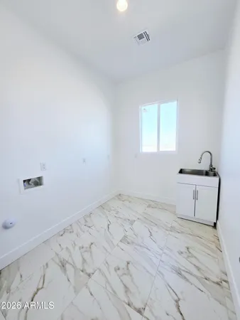 a bedroom with a bed and a ceiling fan