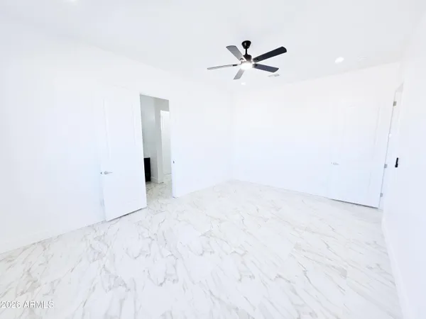 a bathroom with a bathtub sink and mirror