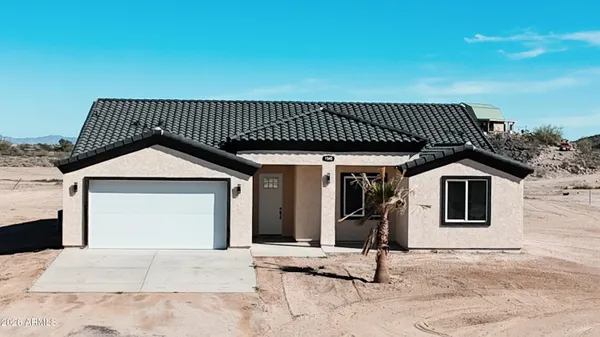 a front view of a house with a garage
