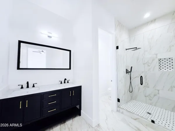 a bathroom with a bathtub and shower