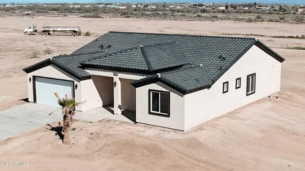 a kitchen with stainless steel appliances granite countertop a stove a sink and white cabinets