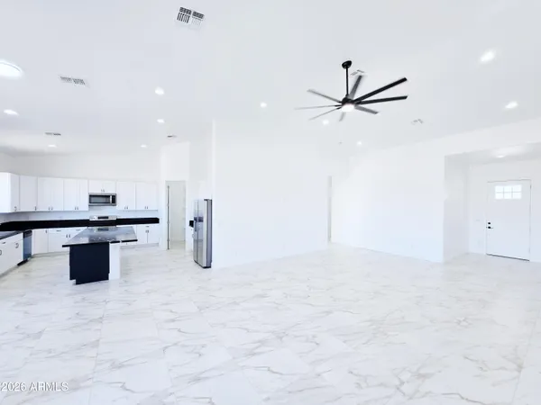 a kitchen with a sink a stove and cabinets