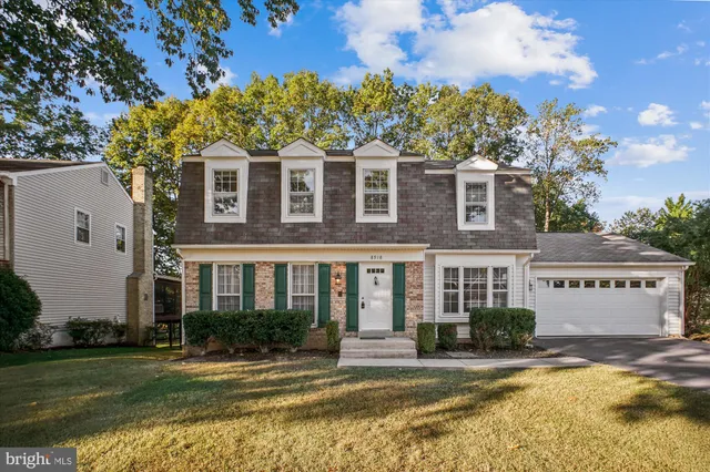 front view of a building with a yard