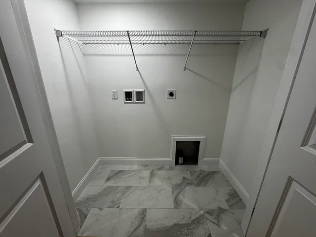 a view of an empty room with windows