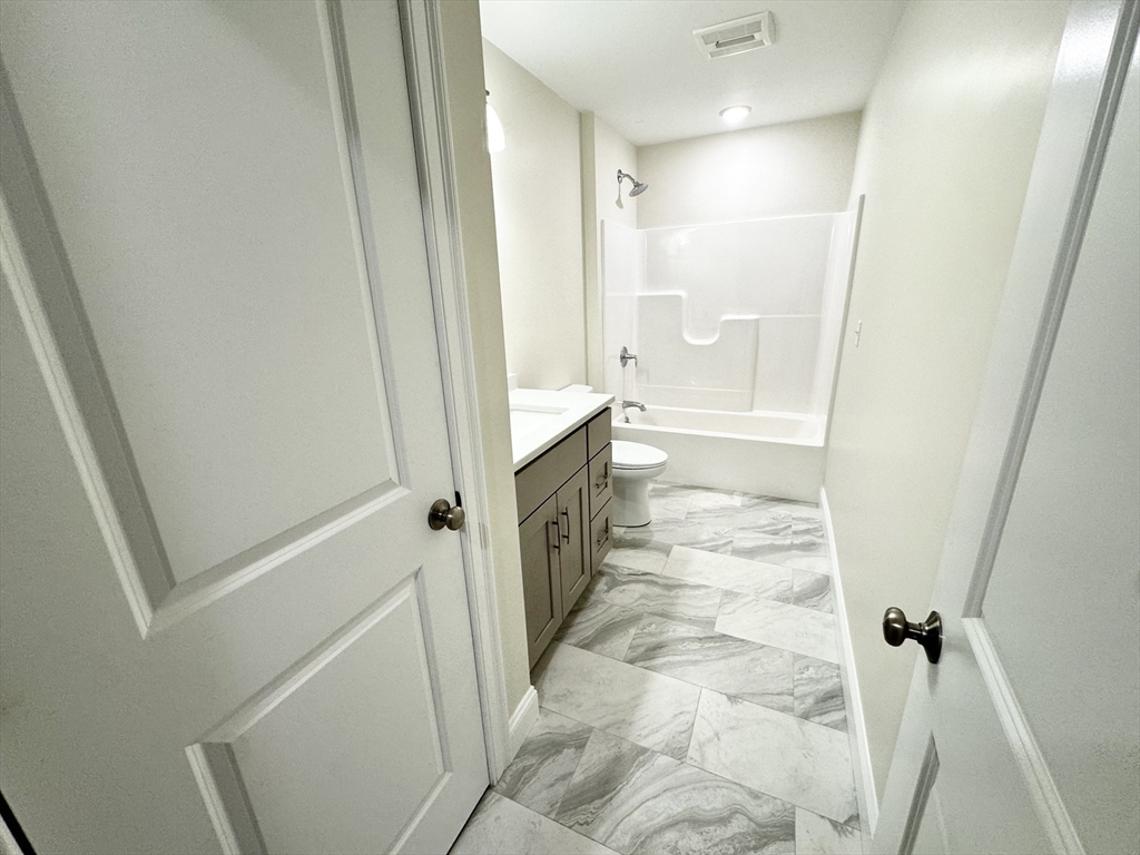 78 Arlington Street, Unit 1 Taunton, MA 02780 - Photo 18 of 28 a bathroom with a sink and a shower