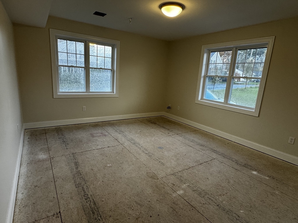 78 Arlington Street, Unit 1 Taunton, MA 02780 - Photo 9 of 28 an empty room with windows