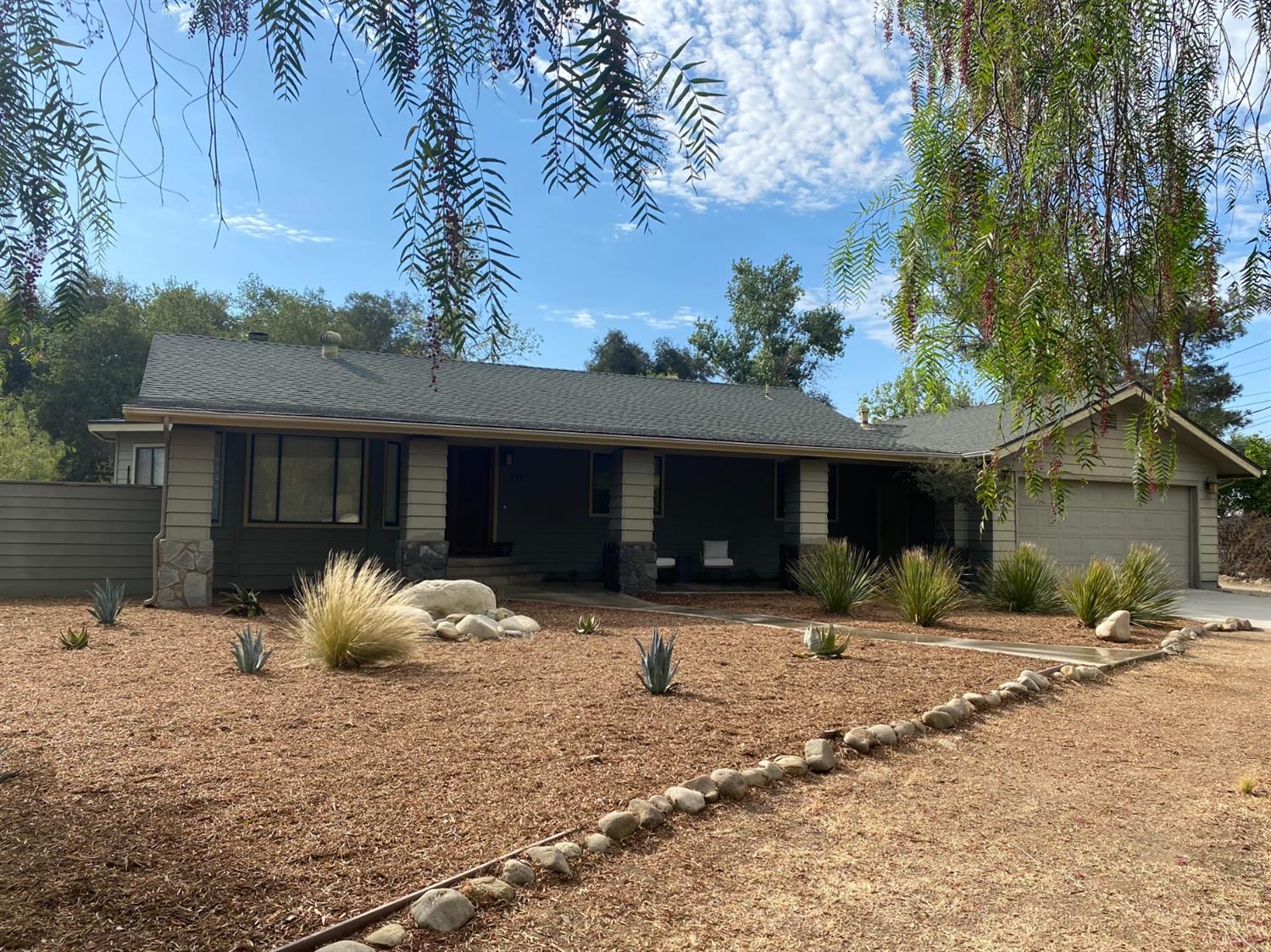 535 Riverside Road, Unit 537 Oak View, CA 93022 - Photo 1 of 22 a front view of a house with a yard and glass windows