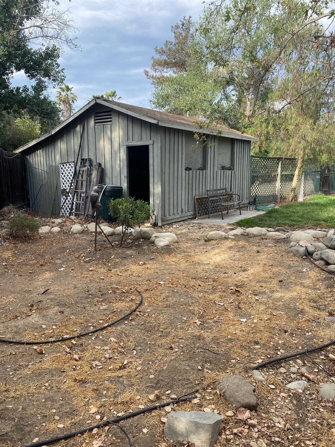 535 Riverside Road, Unit 537 Oak View, CA 93022 - Photo 8 of 22 a backyard of a house with yard and garage