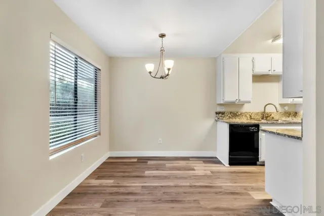 a view of a kitchen cabinets and wooden floor
